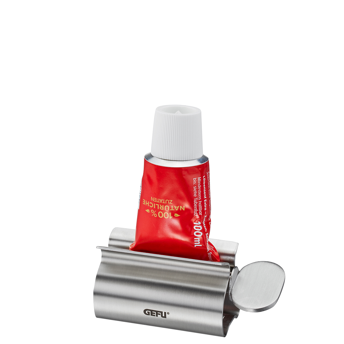 GEFU Tubenausdrücker aus Edelstahl mit Tube Metal Tubenausdrücker von GEFU mit eingelegter roter Tube