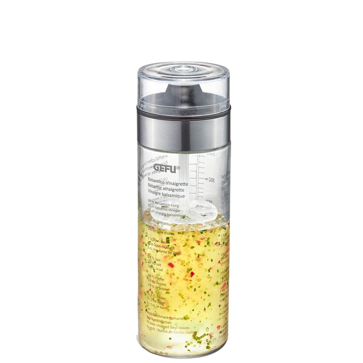 Praktischer Dressing Shaker mit Messskala Ein transparenter Dressing Shaker mit silbernem Deckel und Messskala, gefüllt mit bunter Vinaigrette