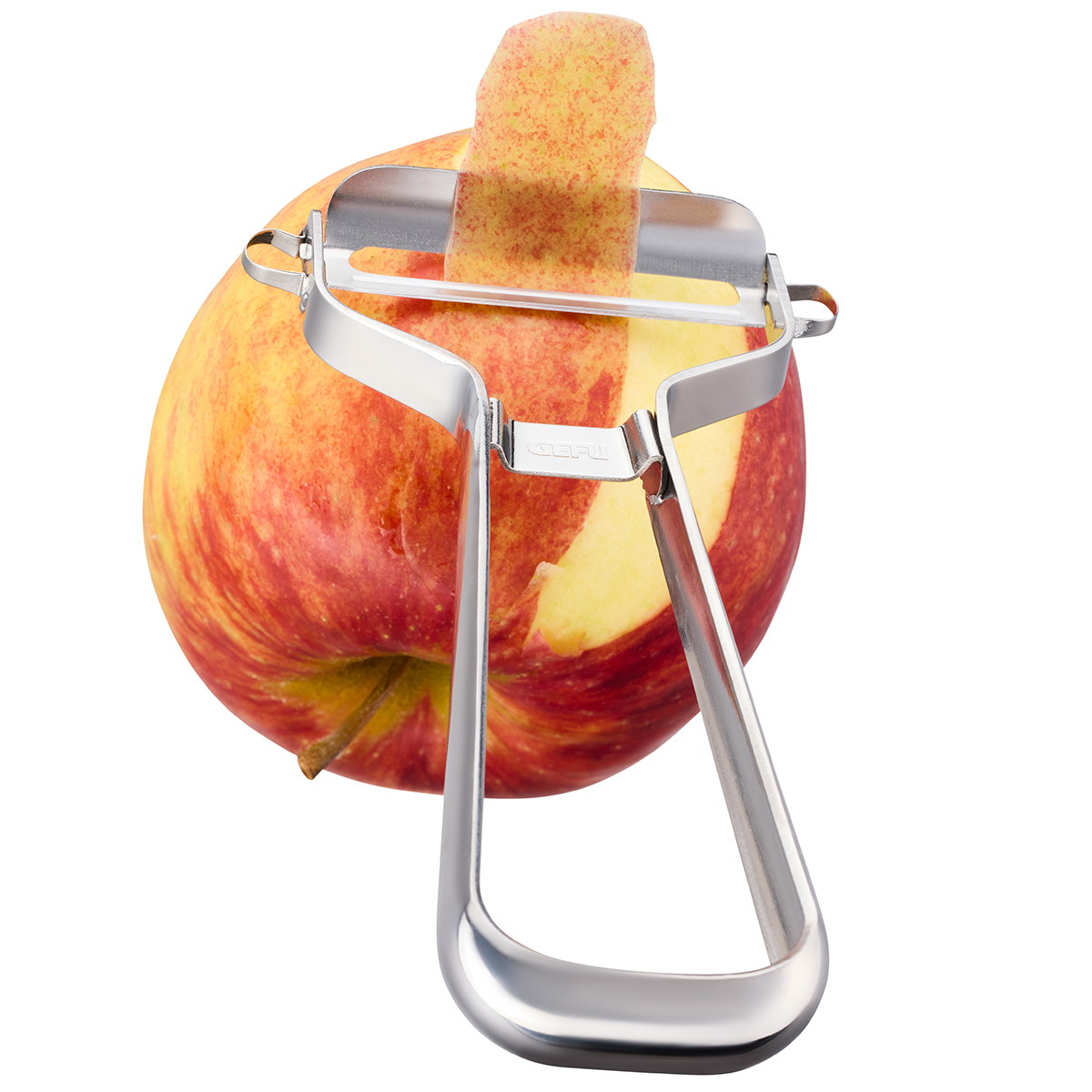 Ein Apfelschäler aus Edelstahl, der eine dünne Schale von einem Apfel entfernt