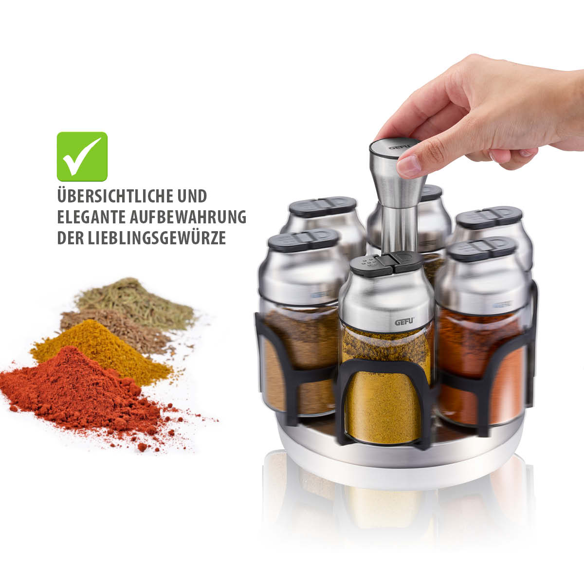 Praktischer Gewürzständer zur übersichtlichen Aufbewahrung Hand bedient eleganten Gewürzständer mit gefüllten Behältern