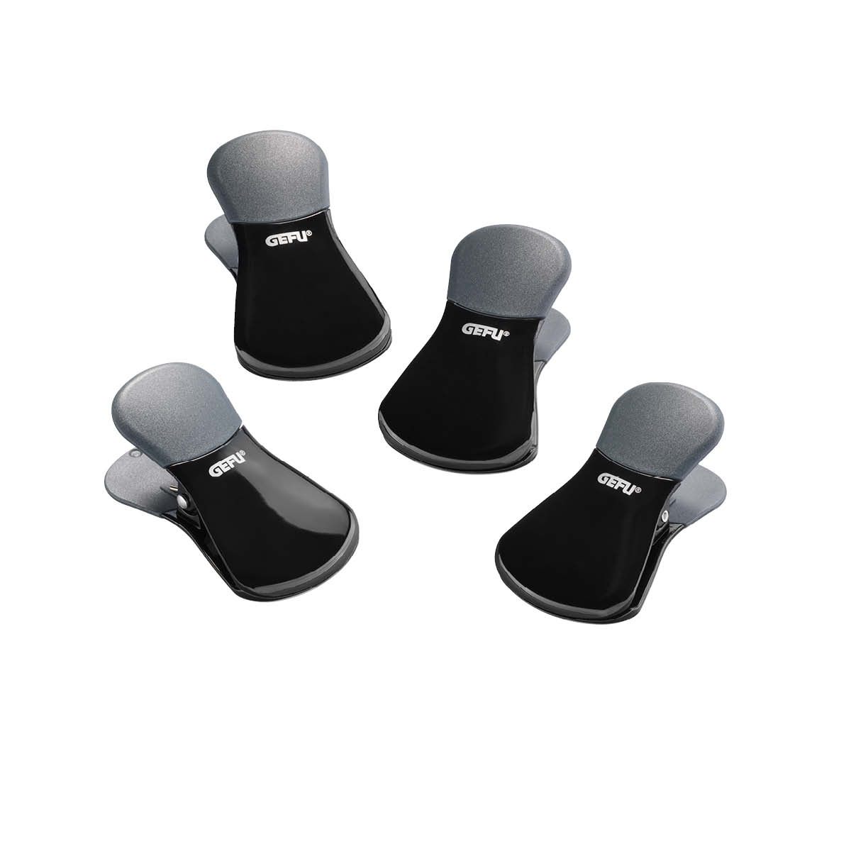 Praktische schwarze Clips im 4er-Set für vielseitige Anwendungen Set von vier schwarzen, funktionalen Clips zur Verwendung im Haushalt oder Büro