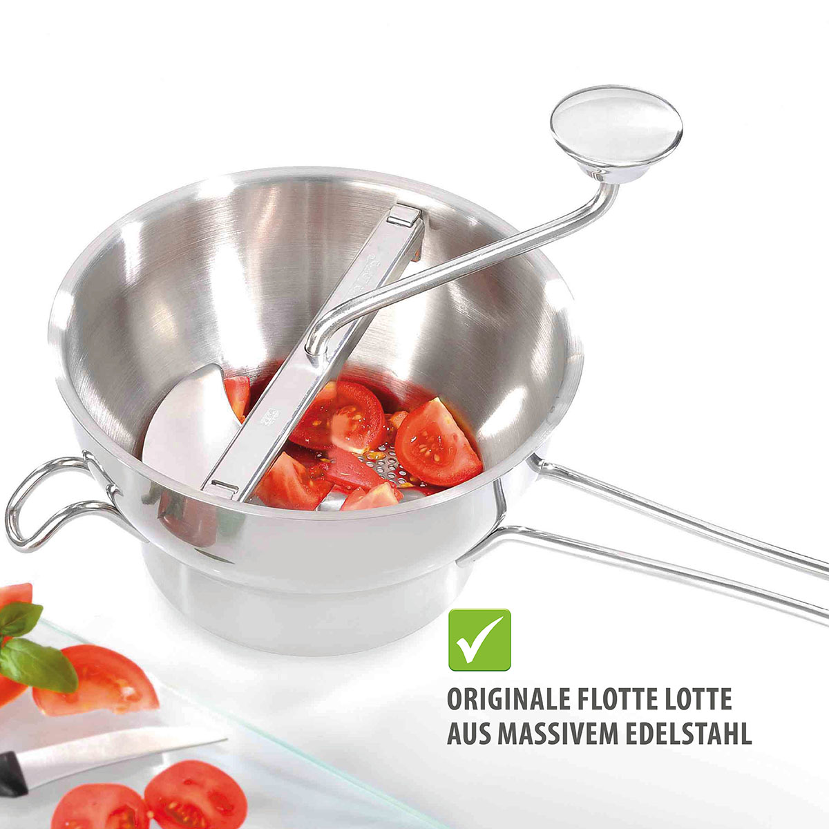 Originale Flotte Lotte aus Edelstahl für perfekte Zubereitung von Tomatensaucen Flotte Lotte aus Edelstahl mit Tomatenstücken, ideal für einfache und effiziente Zubereitung von Saucen